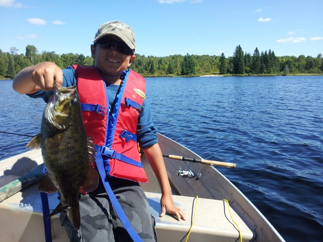 2012-08-29 11.58.57.jpg - Josh on Clear Lake near Arnstein with his 1st Smallie of the day.